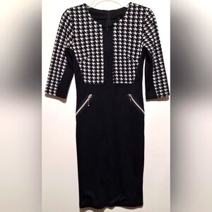 BLACK AND WHITE HOUNDSTOOTH FITTED KNEE LENGTH DRESS. ZIPS IN FRONT & BACK.
